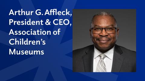 dark blue graphic with a man's photo headshot