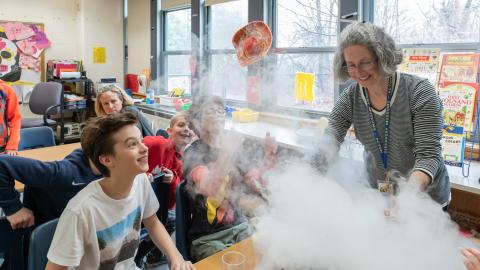 a teacher and students explore dry ice