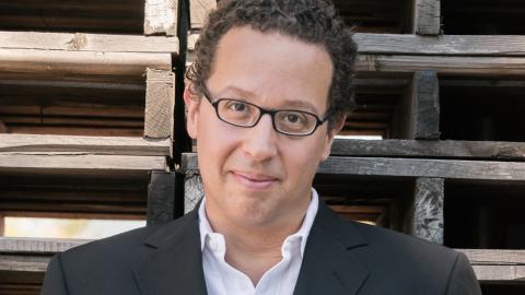 man with glasses wearing blazer