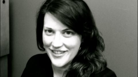 Woman wearing black shirt with dark hair