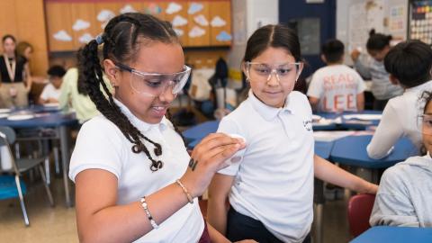 two students in a chemistry workshop