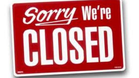 red sign that says, "Sorry, we're CLOSED"
