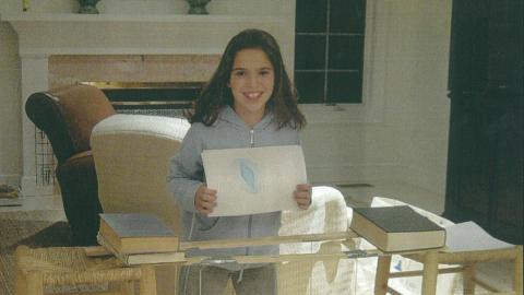 a girl and her made-at-home suspended table, called a harmonograph