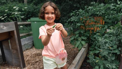 girl holding seed
