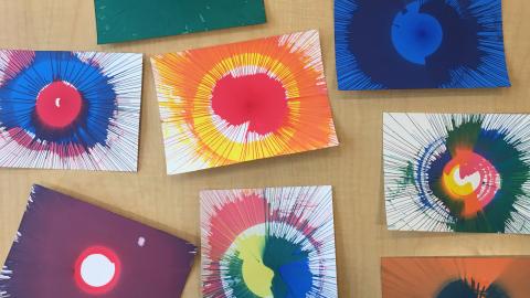A tabletop display of spin art creations