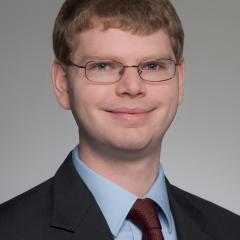 a headshot photo of Justin Kliger