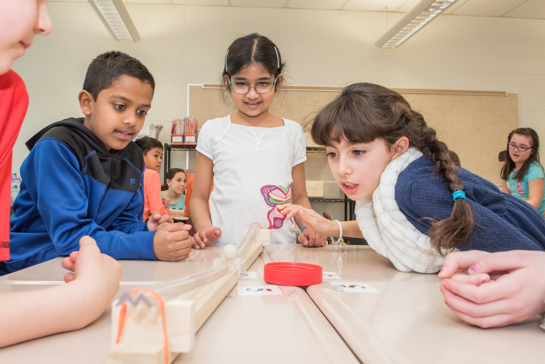 children participating in a school science program