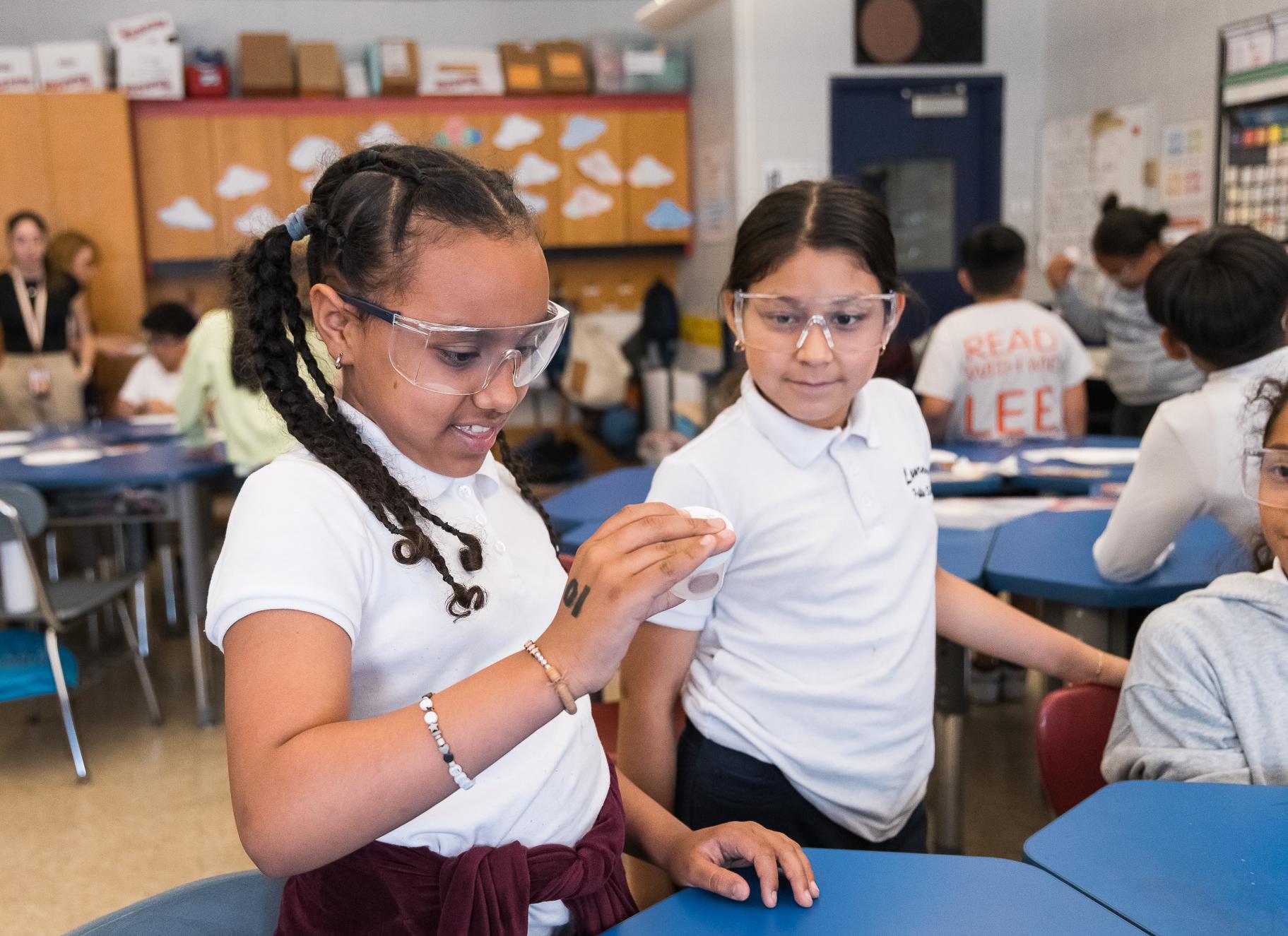 two students in a chemistry workshop